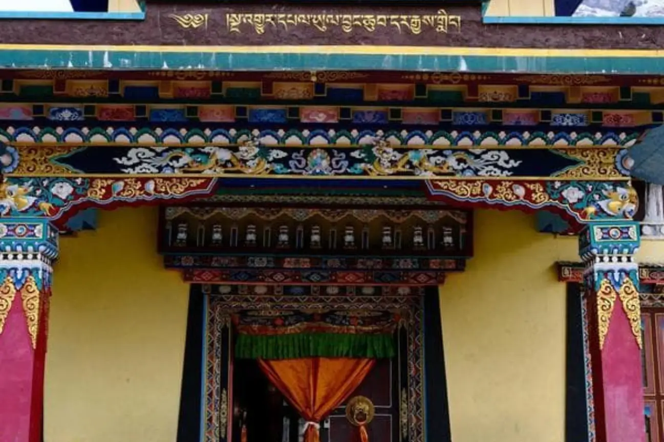 Experience The Rich Culture On The Annapurna Circuit Close-up of an ornately painted entryway to a Tibetan-style building on the Annapurna Circuit trek.